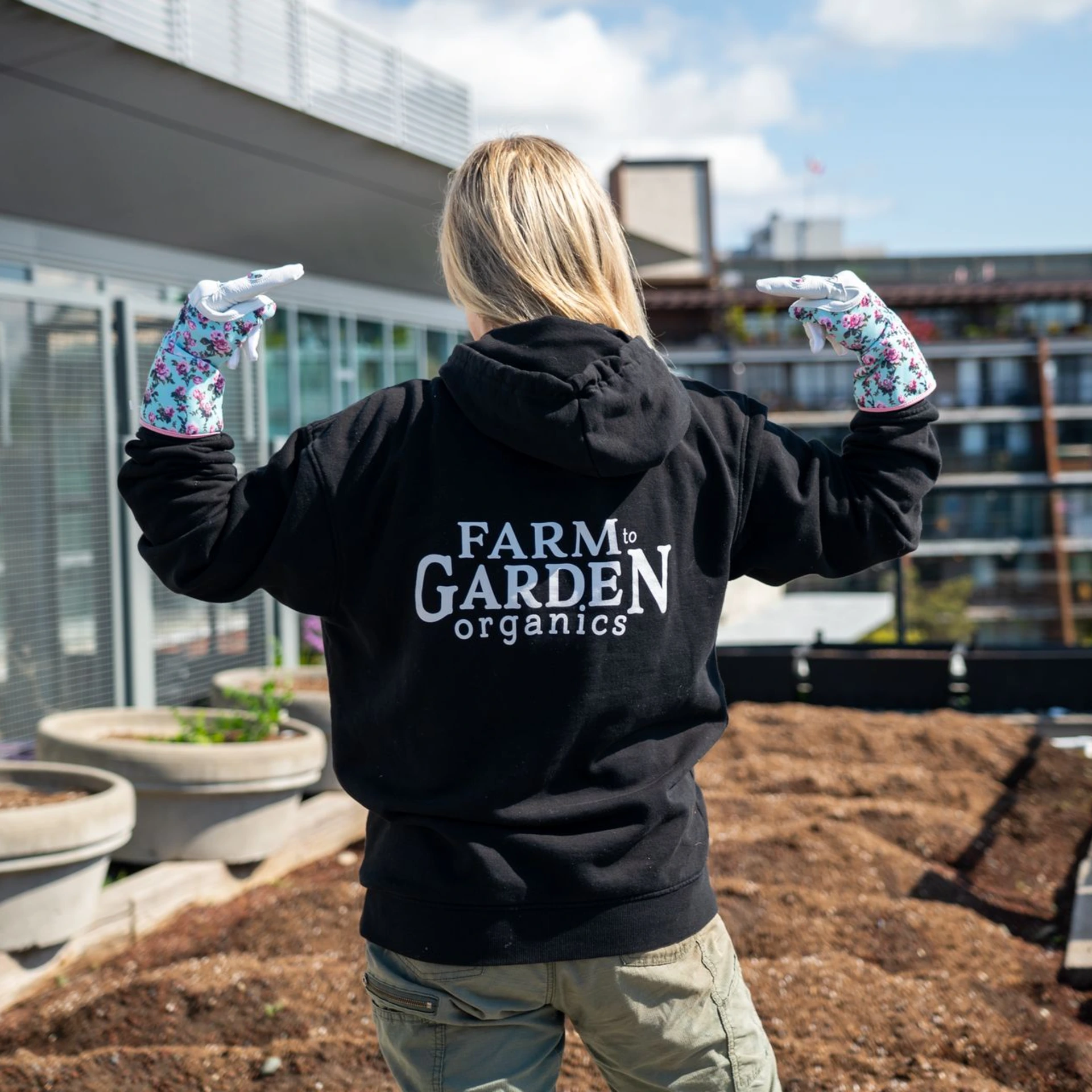 Tasha wearing a Farm To Garden hoodie